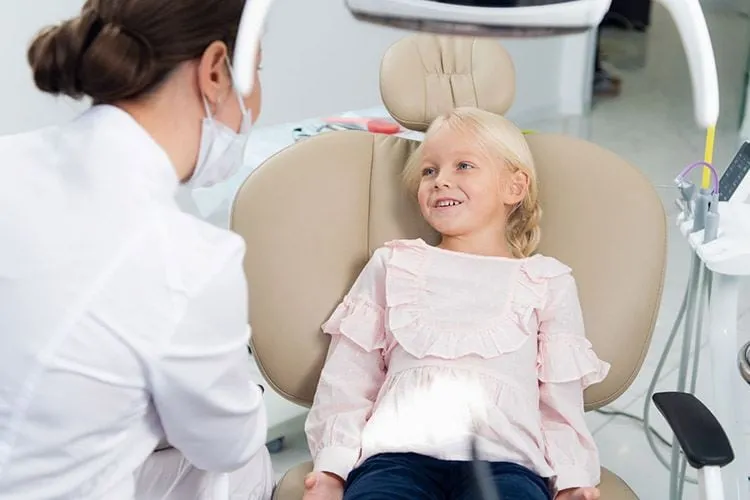 Little Girl Having Teeth Checked by Doctor Dental Clinic